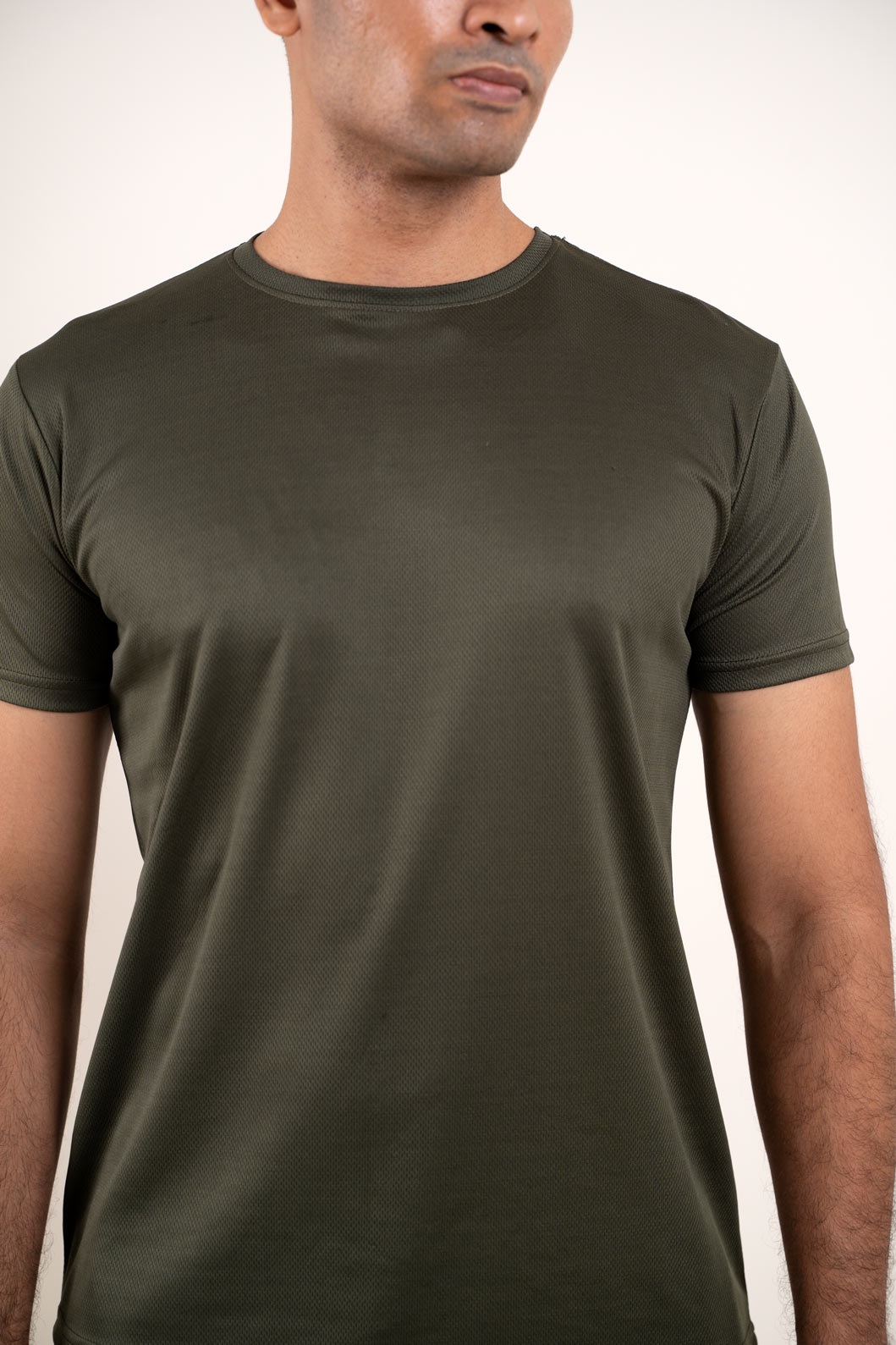 Frontal perspective of the olive crew neck t-shirt, highlighting its modern and stylish appeal