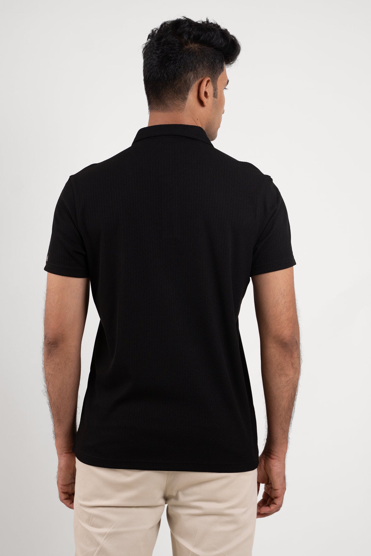 Man wearing black polo tshirt 
