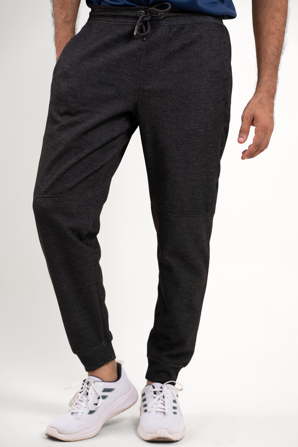 Frontal perspective of the black joggers, showcasing their versatile design and relaxed fit