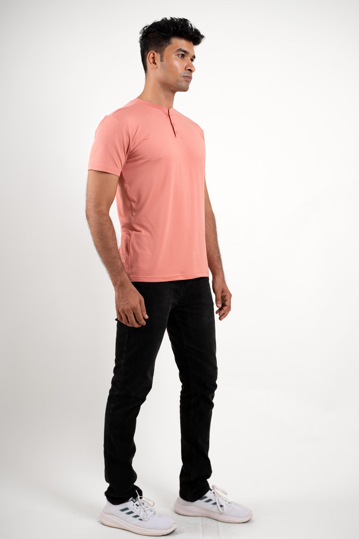 Front view of the peach Henley t-shirt, capturing its vibrant color and classic style