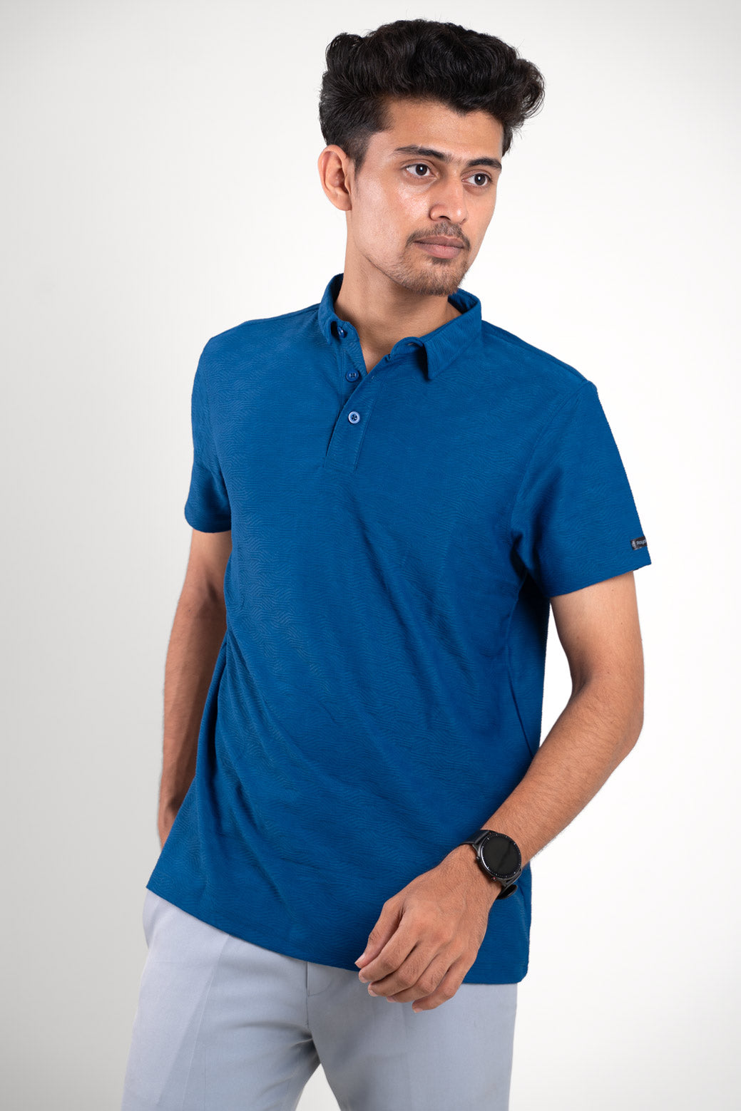 side view of man wearing blue tshirt