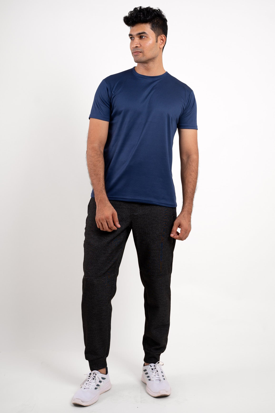 Overall view of the navy blue crew neck t-shirt, capturing its athletic style and versatile appeal