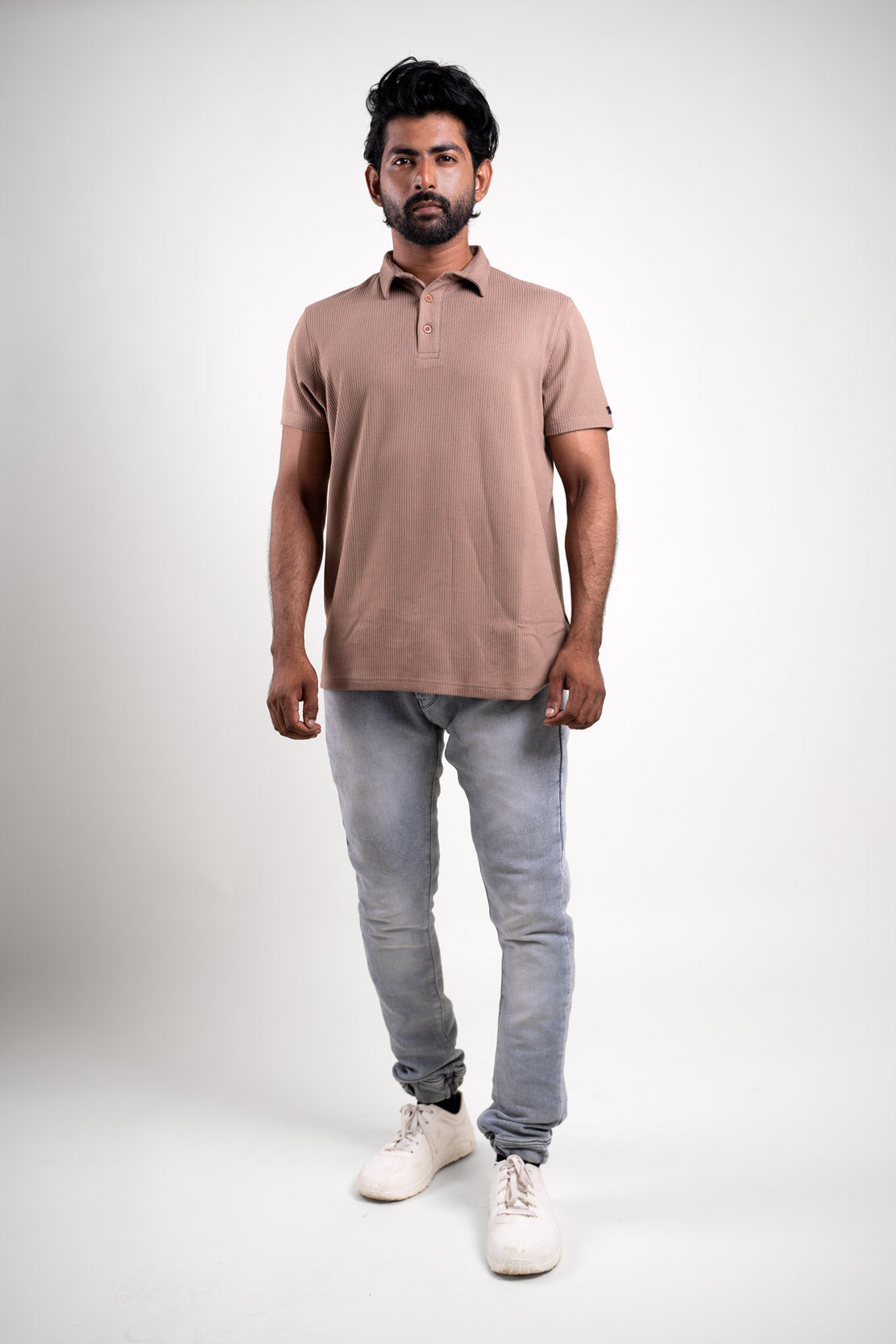 Full-length image of the textured light brown polo t-shirt, providing a comprehensive look at its overall design