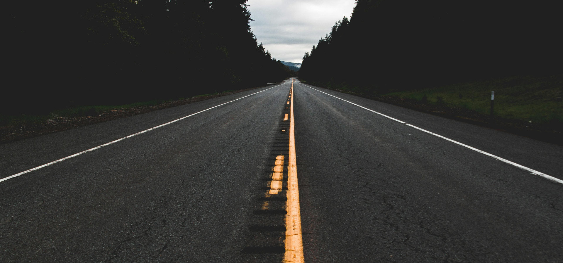 A winding road stretching into the horizon, symbolizing vision and forward progress