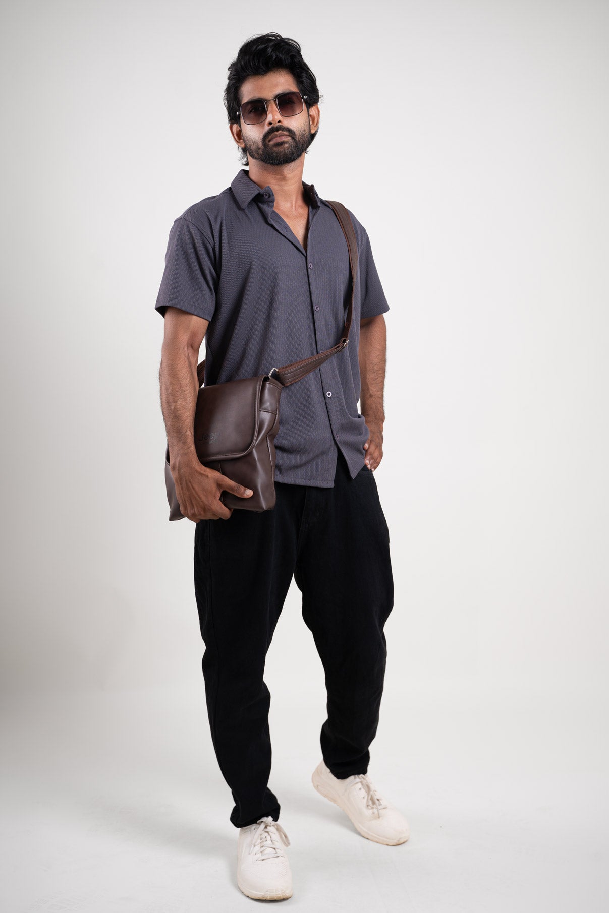 A detailed description highlighting the unique texture and timeless elegance of the solid textured blue shirt, making it a wardrobe staple for any occasion