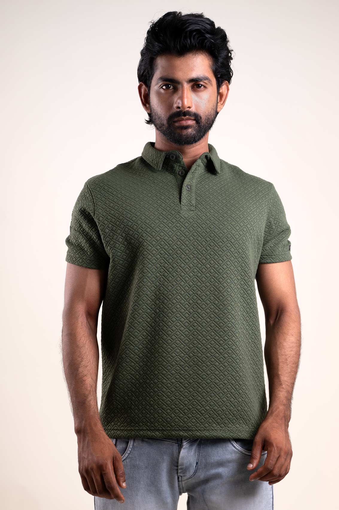 Frontal perspective of the green polo t-shirt, showcasing its unique and textured appearance